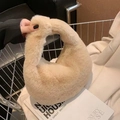 Chic beige faux fur handbag featuring a soft plush texture and integrated handle design - Khaki