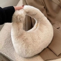 Chic beige plush crescent handbag made of soft faux fur with gold zipper detail - Beige