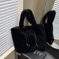 Large black faux fur tote bag featuring elegant leather drawstrings and silver metal tips - Black