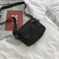 Minimalist black canvas crossbody bag with multi-pocket design and adjustable strap - Black