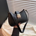 Chic black saddle shoulder bag with a gold rectangular buckle and sleek faux leather - Black