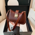 Classic dark brown leather half-moon saddle bag with a golden square buckle closure - Brown