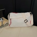 Minimalist cream white nylon crossbody bag featuring waffle texture and red zipper pulls - Off White