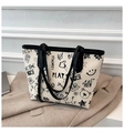 Borsa tote con stampe graffiti carine e manici neri su base color crema minimalista - Nero