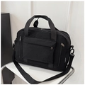 Black lightweight nylon travel bag with dual handles and detachable shoulder strap - Black