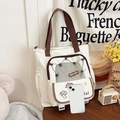 Minimalistische canvas draagtas in crème met bruine hengsels en Happy Days patch - Broken Wit