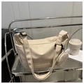 Creamy white nylon shoulder bag with a small round pouch and wide adjustable strap - Khaki
