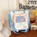 Multikleurige canvas draagtas met pastelkleurige panelen en verstelbare blauwe schouderriem - Blauw