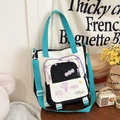 Canvas tote bag in black and white patchwork with vibrant turquoise blue straps - Black