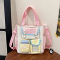 Tragetasche aus Canvas in Rosa und Beige mit mehreren Taschen und Schultergurt - Rosa & Gelb
