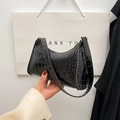 Mini black crocodile embossed hobo bag with a sleek patent finish and a single shoulder strap - Black