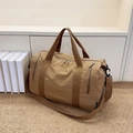 Deep khaki nylon duffle bag with three front zip pockets and adjustable shoulder strap - Brown