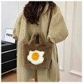 Brown plush crossbody bag with fried egg design and gold chain strap shown on model - Dark Brown