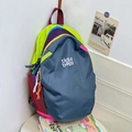 Wasserdichter, mehrfarbiger Rucksack in Graublau mit neongrünen und lila Akzenten - Color Block