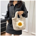Detail of plush crossbody bag featuring a soft faux fur texture and creative fried egg decor - Dark Khaki