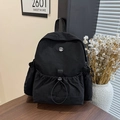 Sac à dos de voyage noir léger en nylon avec poche à cordon et logo métallique M stylé - Noir