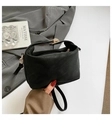 Minimalist black matte leather crescent handbag with gold hardware and shoulder strap - Black