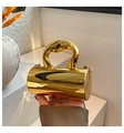 Glossy gold cylinder chain handbag with mirror finish and metallic top handle for women - Dark Gold