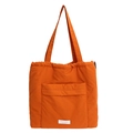 Minimalist bright orange padded tote bag with drawstring closure and brand label - Orange