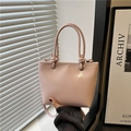 Pink leather bucket tote bag with knot handles and silver metal eyelets for women - Pink