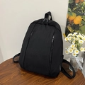Minimalist solid black backpack in lightweight nylon fabric for daily commuting - Black