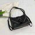 Minimalist black PU tote bag with silver zippers and buckle strap on white fabric - Black