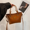 Bolso bombonera vintage de cuero marrón con logo triangular y asa decorativa de nudo - Marrón