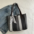 Vertical striped knit tote bag with brown leather handles and polka dot scarf detail - Black