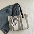 Grey striped canvas tote bag with brown leather handles and a polka dot scarf detail - Green