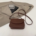 Minimalist dark brown crossbody bag in premium PU leather with embossed fashion lettering - Brown