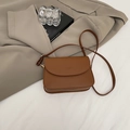 Brown leather crossbody bag with rounded flap and adjustable gold hardware strap - Brown