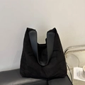 Large black minimalist commute tote bag with premium matte texture and wide straps - Black