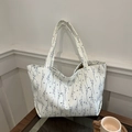 Minimalist white canvas tote bag with elegant blue floral print and dual shoulder straps - Blue Plant Print