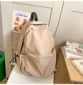 Vista laterale dettagliata dello zaino in tela beige con tasche laterali a coulisse - Cachi