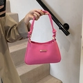 Rosafarbene Umhängetasche mit Wellenstruktur und elegantem Knotendetail am Griff - Rosa