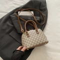 Stijlvolle beige handtas met geometrische print en donkerbruine lederen handvaten - Grijs