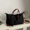 Large black nylon tote bag with brown leather accents and a matching mini pouch charm - Black