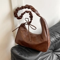 Dark brown crescent cloud bag with pleated strap and decorative bow detail - Brown