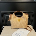 Retro bucket bag with khaki canvas and brown leather straps in a minimalist aesthetic - Brown