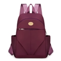 Waterproof nylon backpack in deep burgundy with front zipper pocket and side pouches - Purple