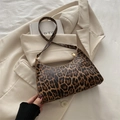 Chic leopard print underarm bag with thin shoulder strap and gold zipper details - Brown