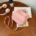 Pink canvas crossbody bag featuring cute sausage dog print and bear plush charm - Pink