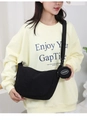 Detail view of black corduroy shoulder bag with removable mini fashion coin pouch - Black