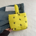 Quilted bright yellow bucket handbag with black bow embroidery and a single top handle - Yellow