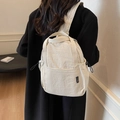 Mini zaino in nylon bianco panna per donna con tasche laterali a coulisse e design moderno - Beige