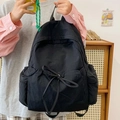 Minimalist black large capacity backpack with bow detail for school and travel - Black