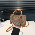 Brown jacquard crossbody square bag with top handles and patterned fabric details - Brown