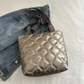 Quilted tote bag in metallic golden brown finish with a vintage paisley patterned strap - Gold