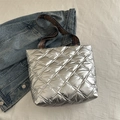 Silver quilted puffer tote bag with ethnic pattern strap and metallic finish - Silver