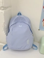 Minimalist light purple school backpack featuring white M embroidery and adjustable straps - Sky Blue